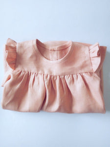 Korana linen long sleeves dress in peachy pink by Zekko Kids Clothes. Ruffles details on shoulders.