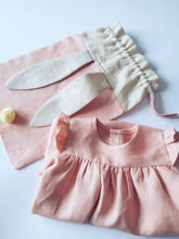Load image into Gallery viewer, bunny bag and ruffle dress in peachy pink linen with bunny ears and fluffy tail. Great to use as slippers bag, toys bag or diaper container.